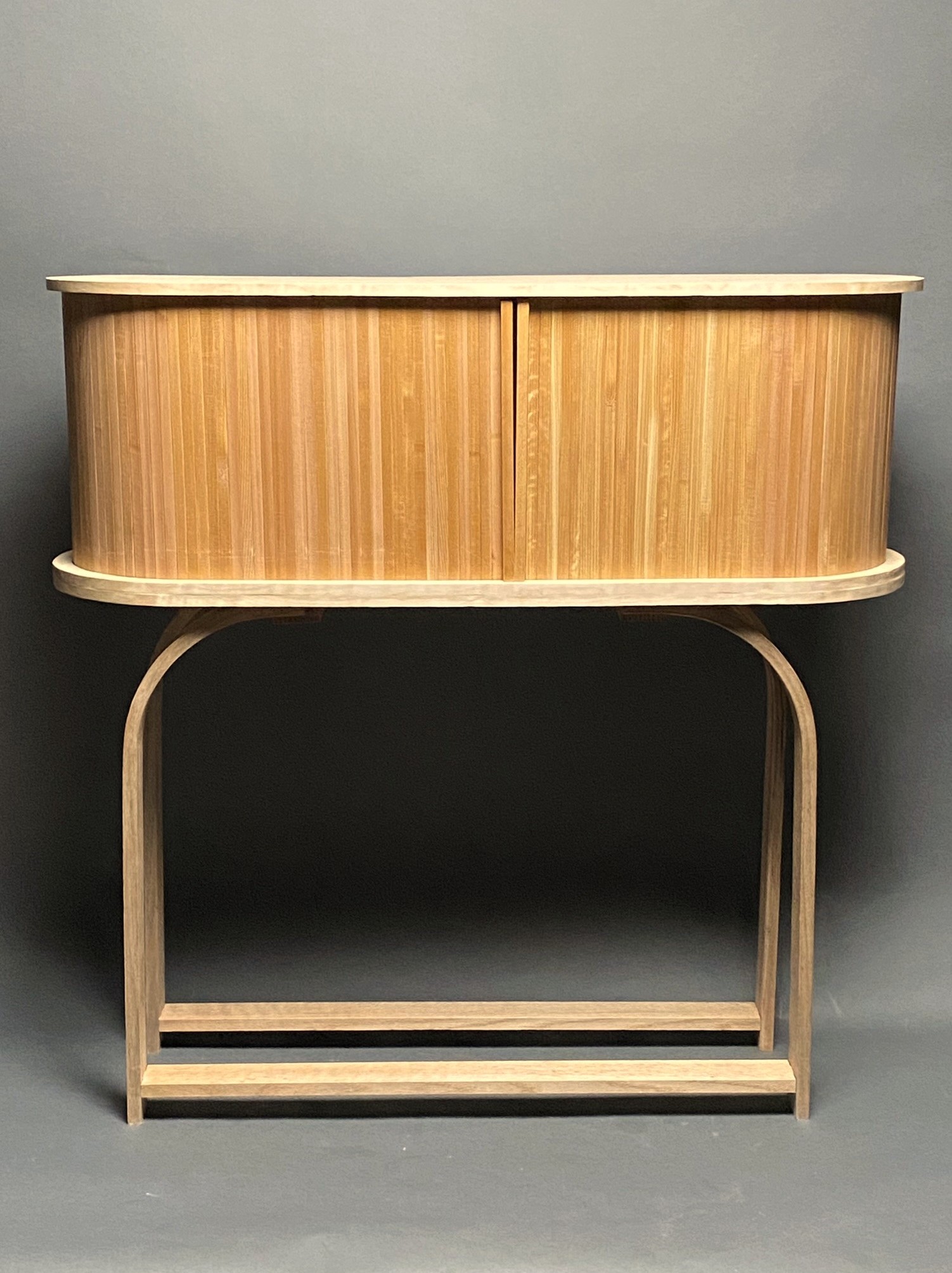 chest with tambour door and steam-bent oak legs.